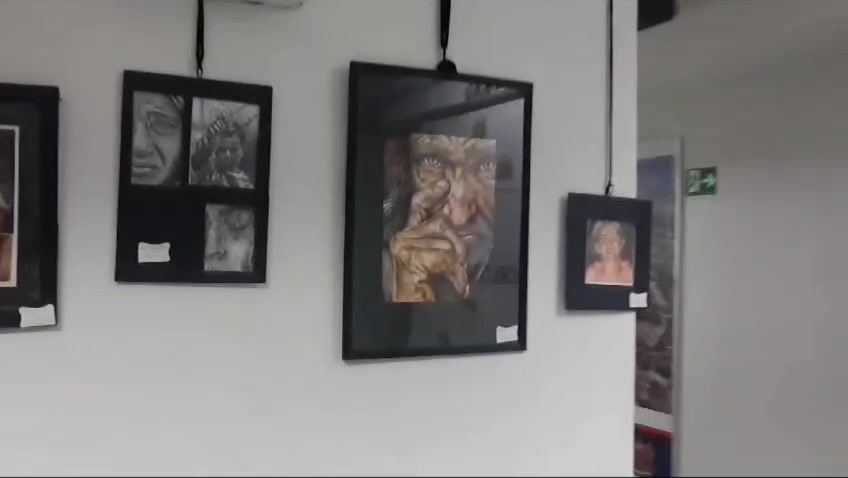 Framed portraits in the Câmara Municipal exhibition
